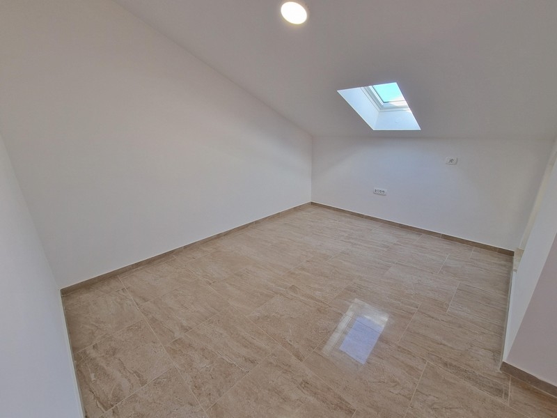 Ložnice v podkroví.