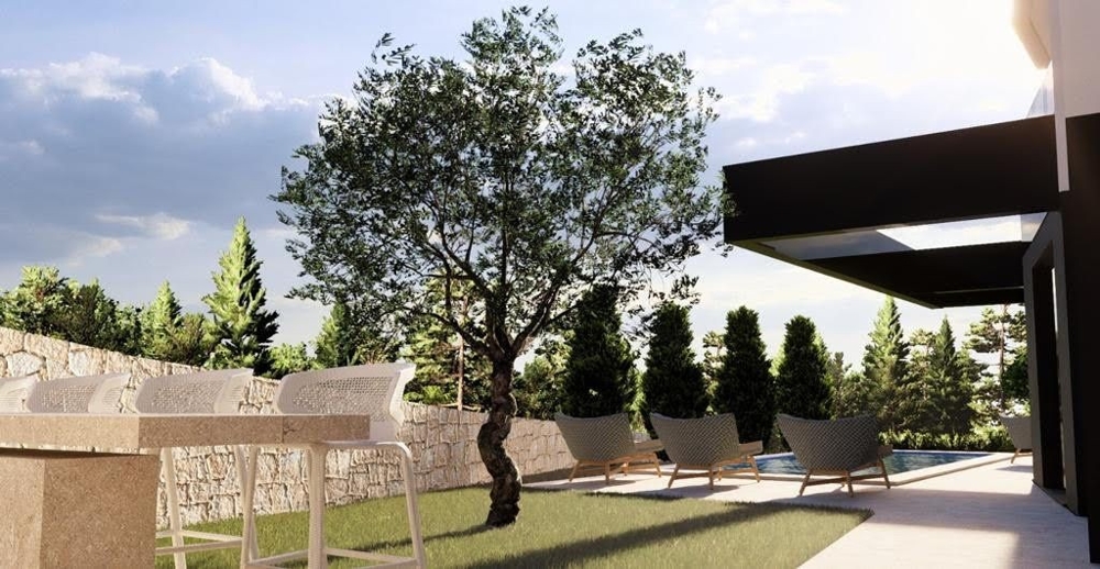 Venkovní relaxační kout chorvatské luxusní vily s výhledem do udržovaných zahrad a stylovým nábytkem - Prodám exkluzivní byt v Chorvatsku.