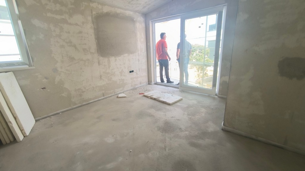 Interiér hrubé stavby, budoucí obývací pokoj bytu, nemovitost Chorvatsko