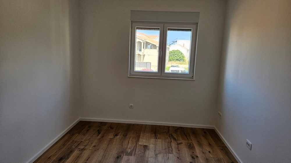 Malá ložnice s parketami.