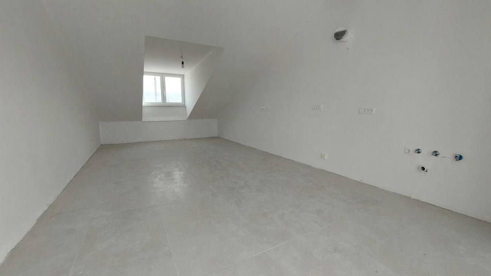 Obytná a jídelní část novostavby.