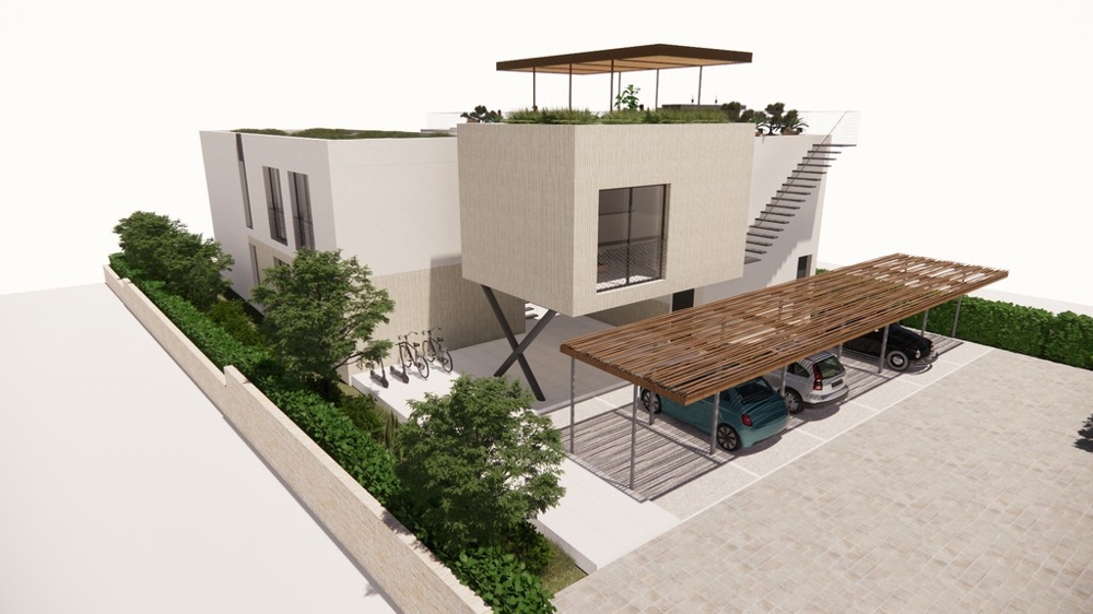 Zadní část budovy s krytým parkováním.