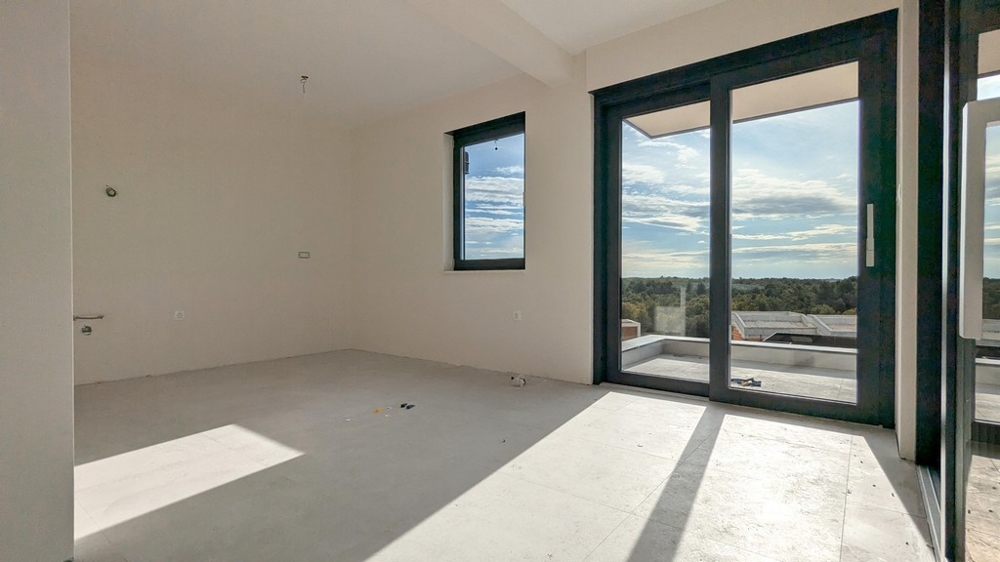 Obývací pokoj se vstupem na terasu bytu A3536 na Istrii.