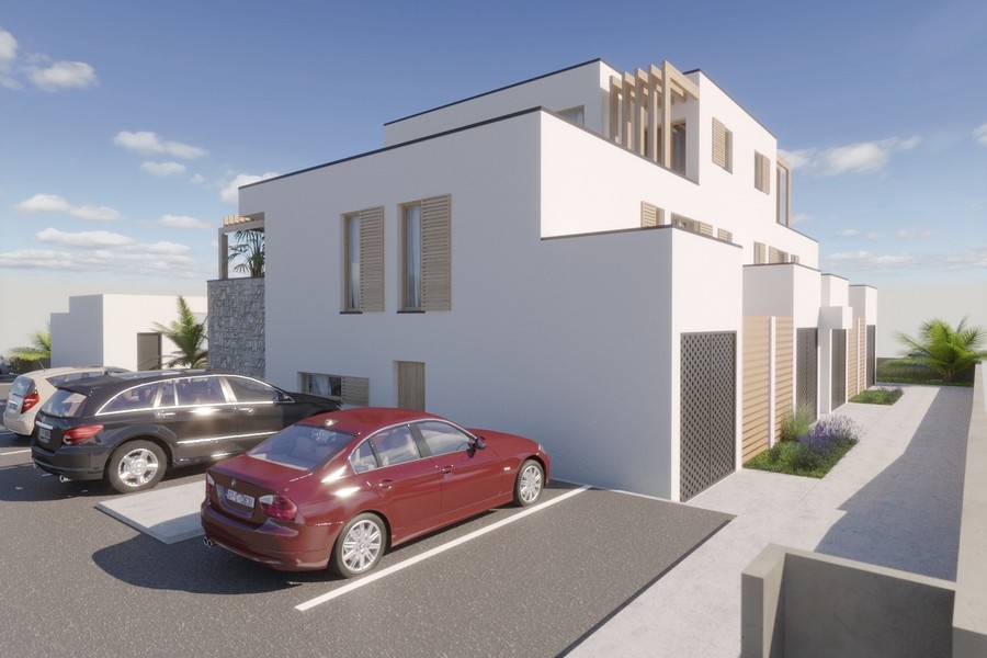 Parkovací místa před moderní novostavbou A3615 v Privlace v Chorvatsku.