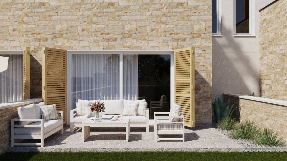 Zařízená terasa s fasádou z přírodního kamene