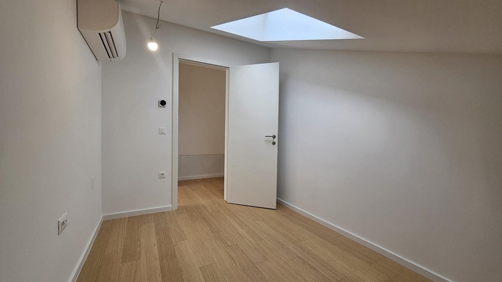 Druhá ložnice se střešním oknem