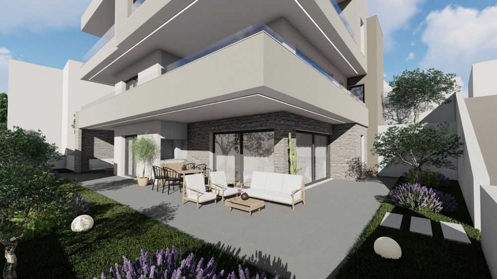 Krytá terasa s obývacím nábytkem a výhledem do krajiny