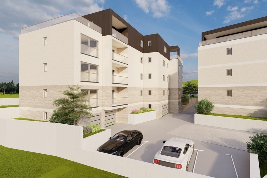 Vizualizace: křídlo budovy s nádvořím a parkovacími místy