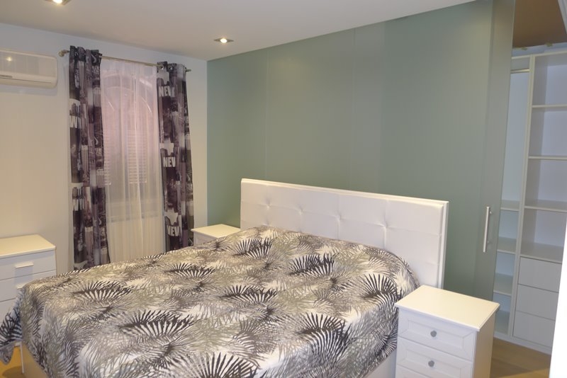 Ložnice v horním patře domu.