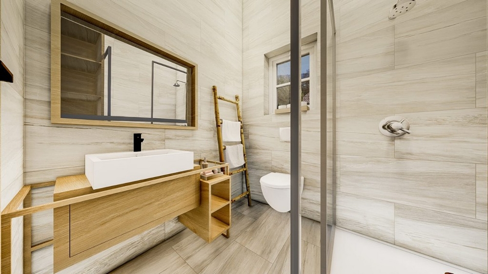 Moderní koupelna se světlým dřevěným nábytkem, velkým zrcadlem, proskleným sprchovým koutem a bílým sociálním zařízením.