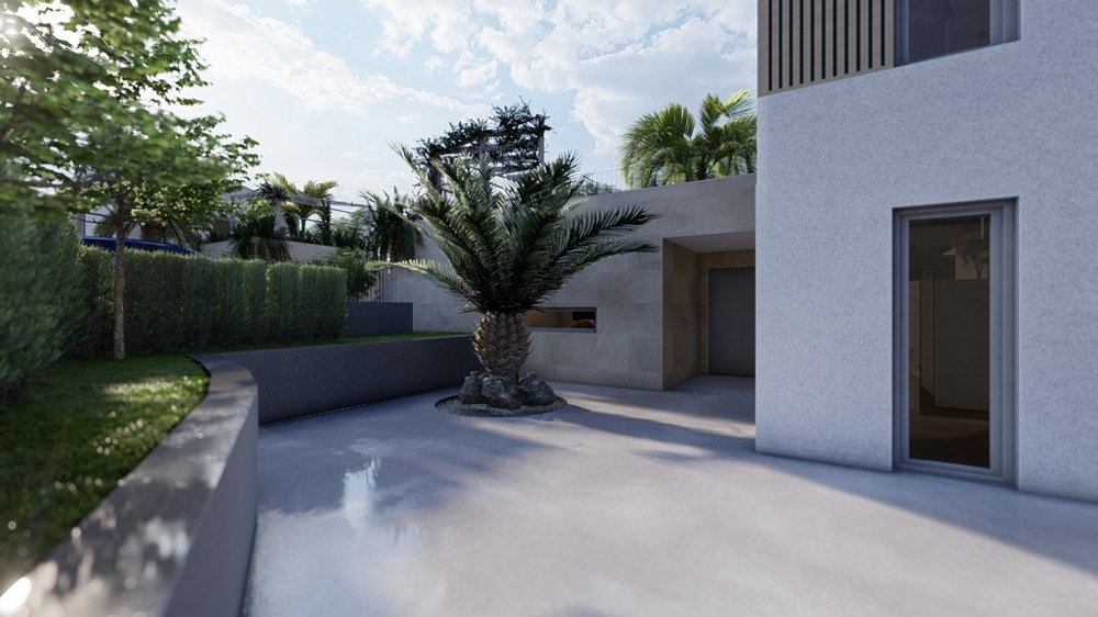 Vstupní prostor s palmou a prostornou příjezdovou cestou