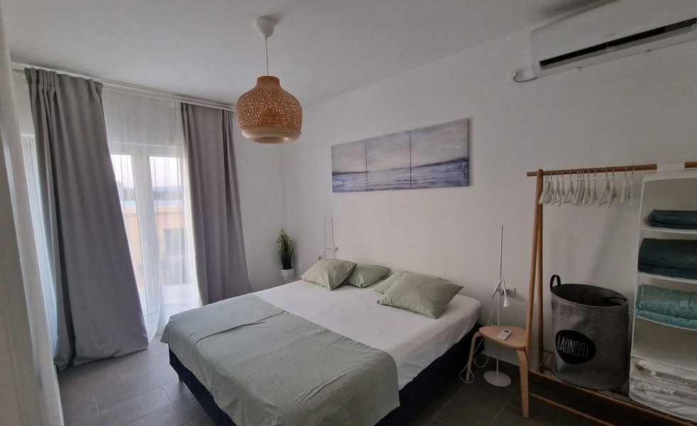 Ložnice s manželskou postelí a klimatizací