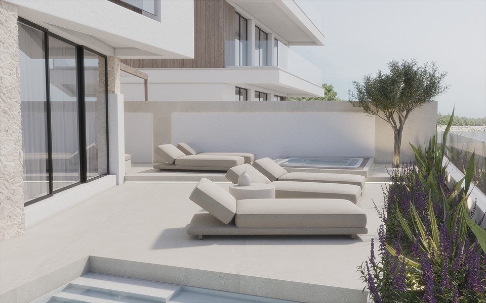 Terasa s moderními lehátky.