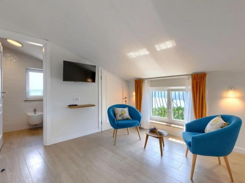 Podkrovní ložnice s posezením