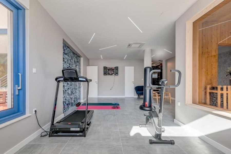 Fitness místnost se saunou