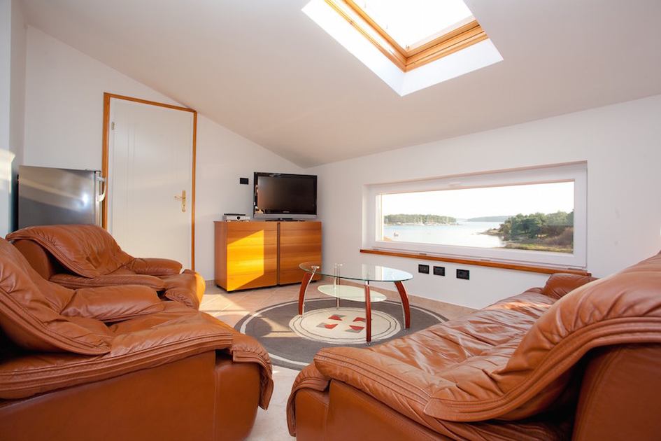 Byt ve vile v nejvyšším patře.